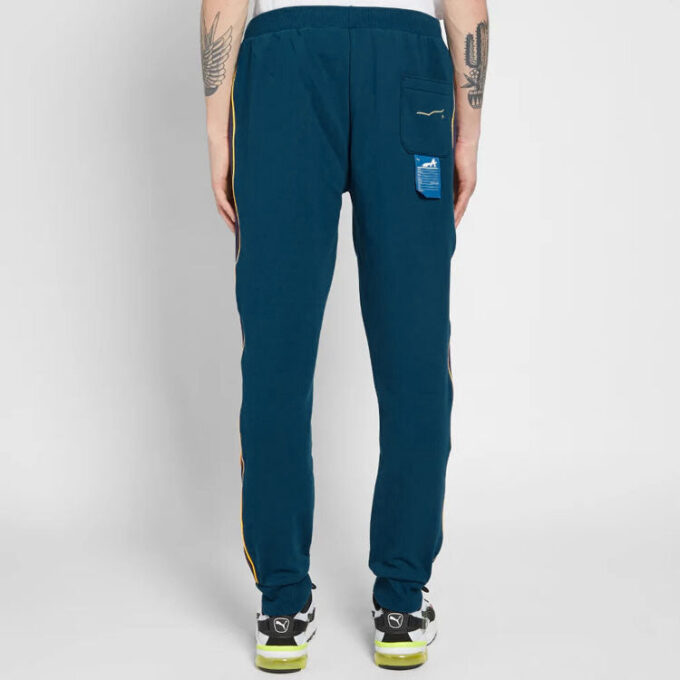 Spodnie dresowe PUMA x Ader Error T7 w kolorze niebiesko-żółtym