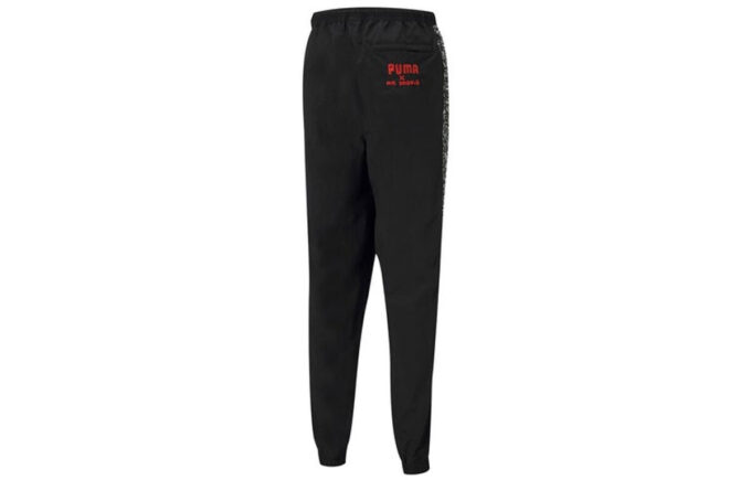 Spodnie sportowe PUMA x Mr Doodle Crossover Graffiti Drawstring Woven Long Pants w kolorze czarnym