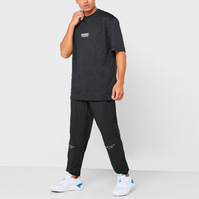 Spodnie tkane PUMA x Randomevent w kolorze czarnym